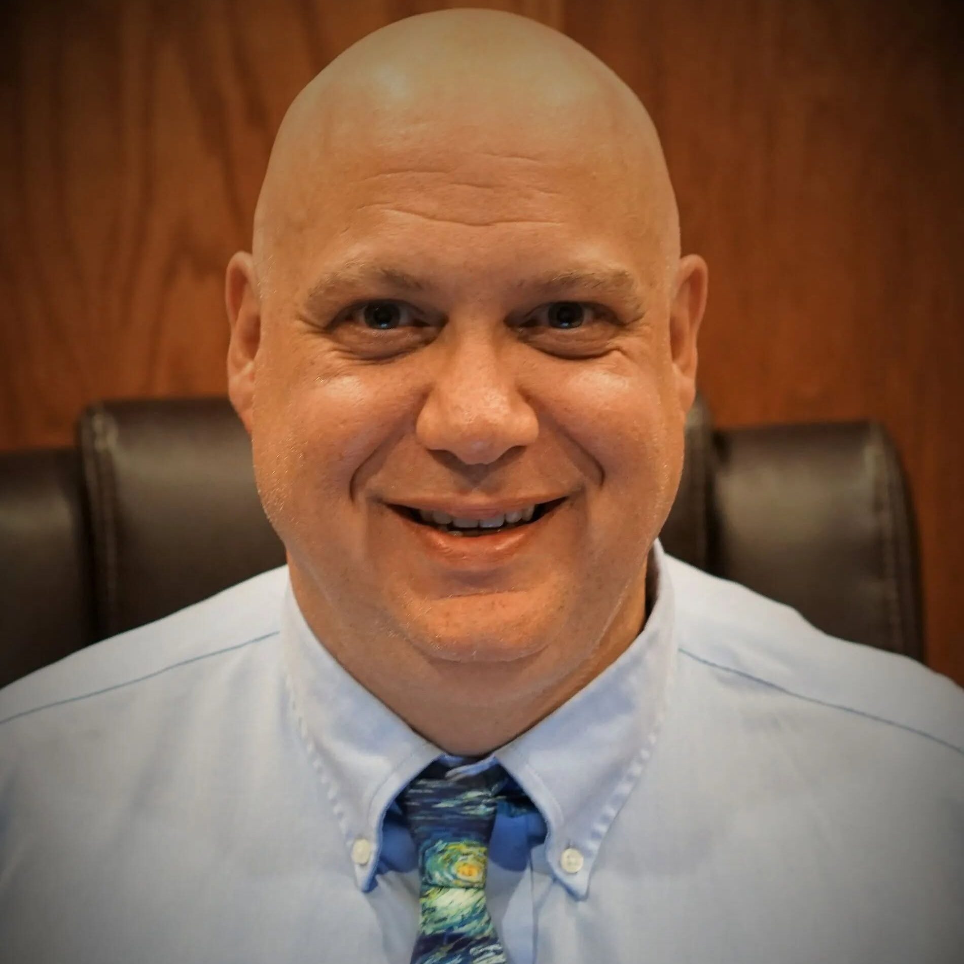 Criminal defense attorney at Law Offices of Geoffrey P Golub PA in Melbourne FL smiling in office headshot